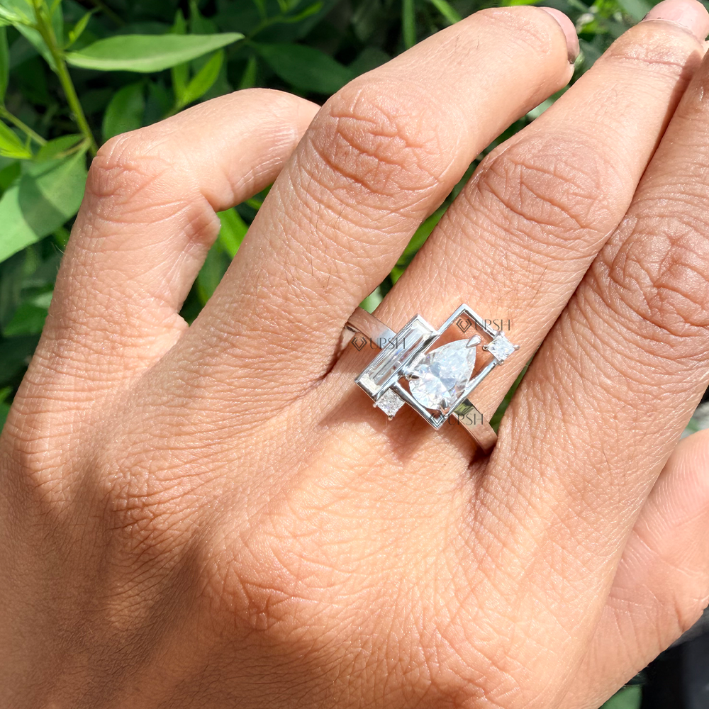 white gold modern geometric mixed-cut diamond ring styled on hand against natural foliage