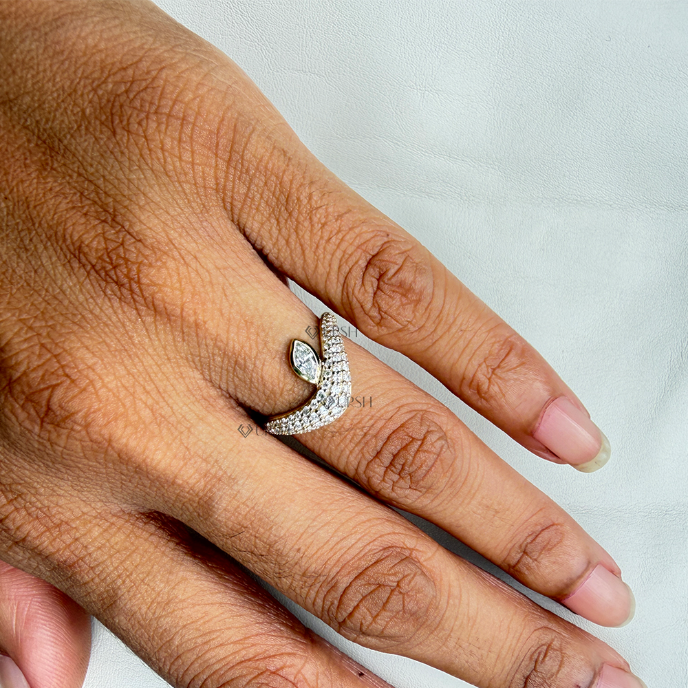 Contoured pavé wave cocktail ring styled gracefully across finger in natural light