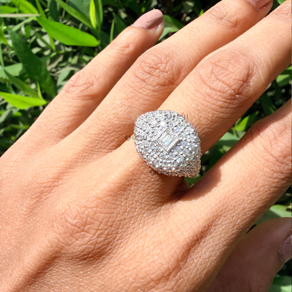 White gold diamond signet statement ring worn on hand outdoors showing finger presence
