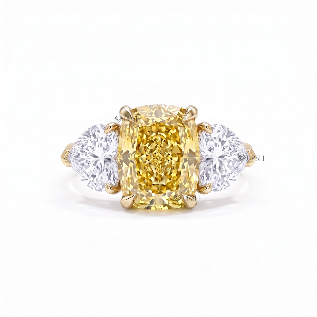 Solid yellow gold three-stone cushion diamond ring with sparkling micro-pavé shank on clean white background
