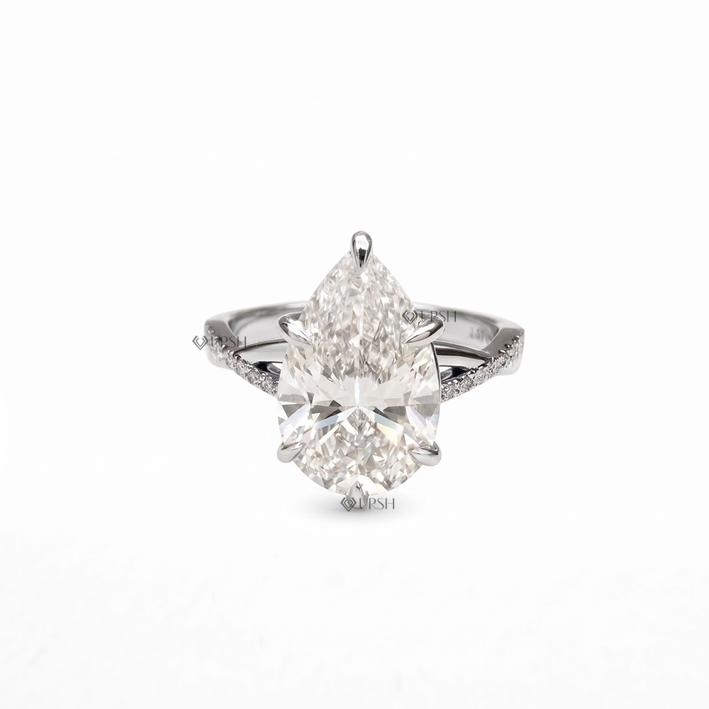 Solid white gold teardrop diamond engagement ring with entwined crossover band