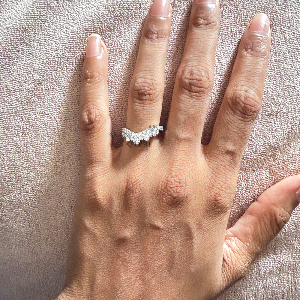 White gold diamond chevron crown band styled elegantly on ring finger