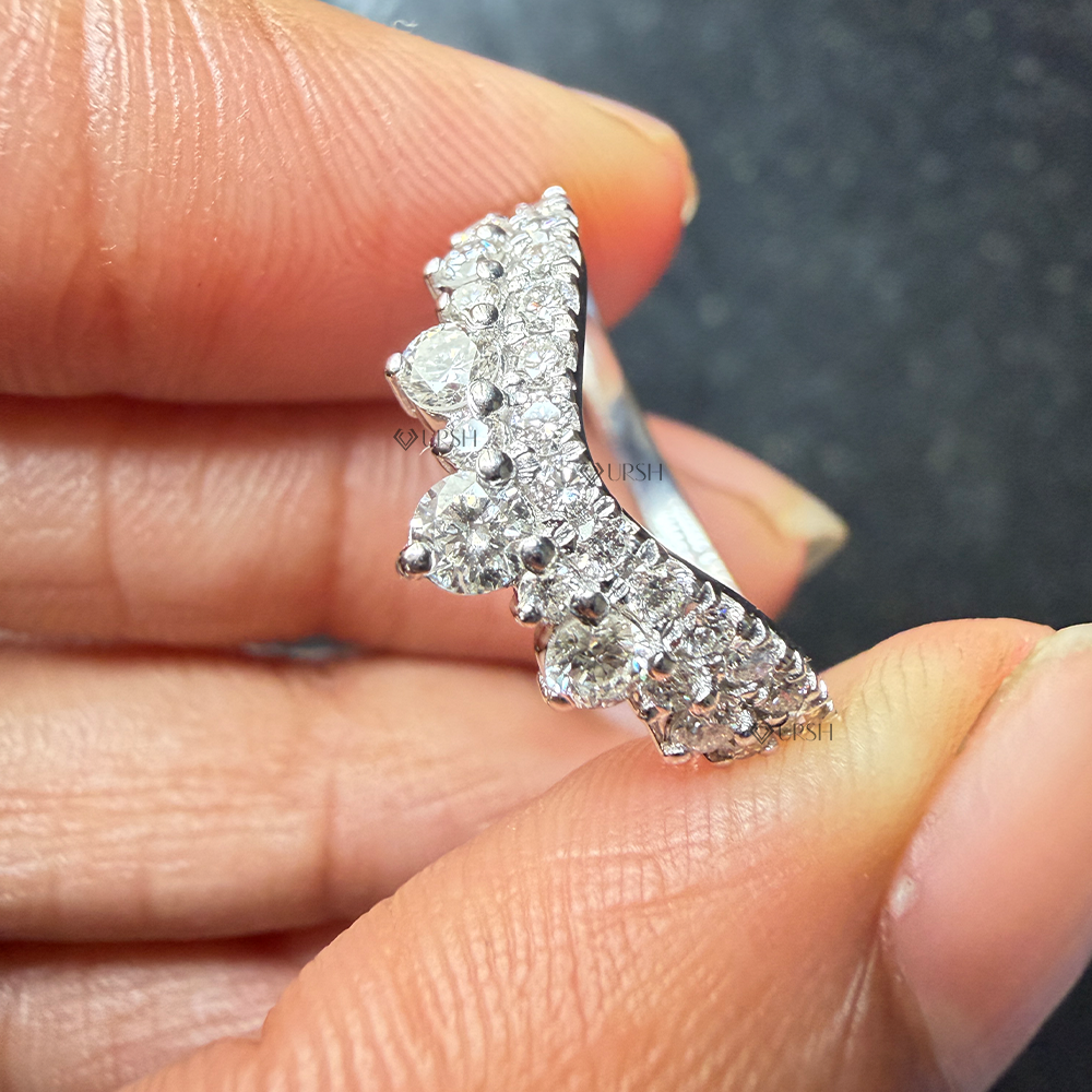 Detailed macro view of shared prong brilliant diamonds along double-row chevron crown band