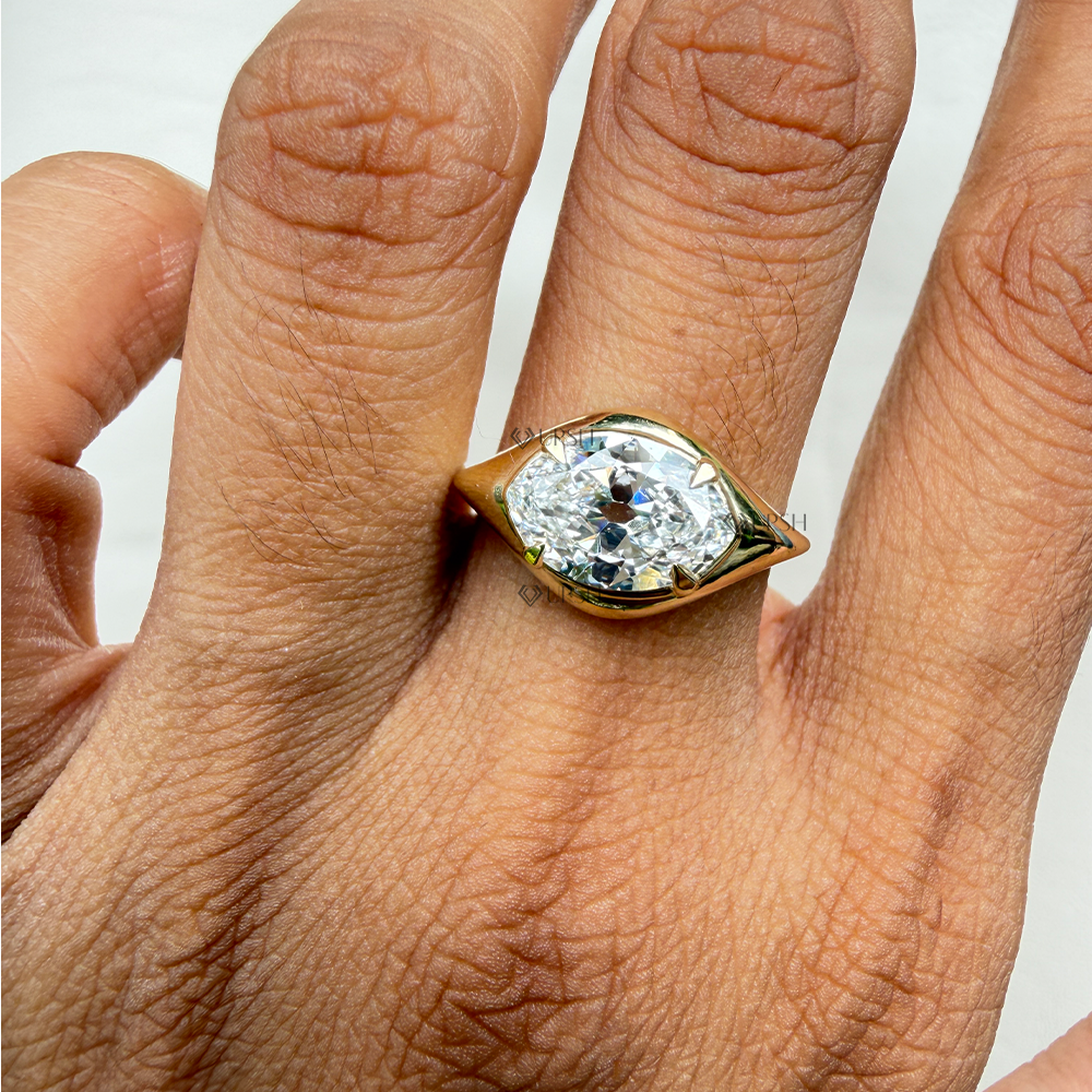 Detailed daylight macro close-up of horizontal marquise lab diamond in solid gold bezel setting
