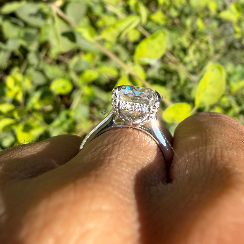 Side angle showing elevated claw prong setting and sparkling micro-pavé hidden halo