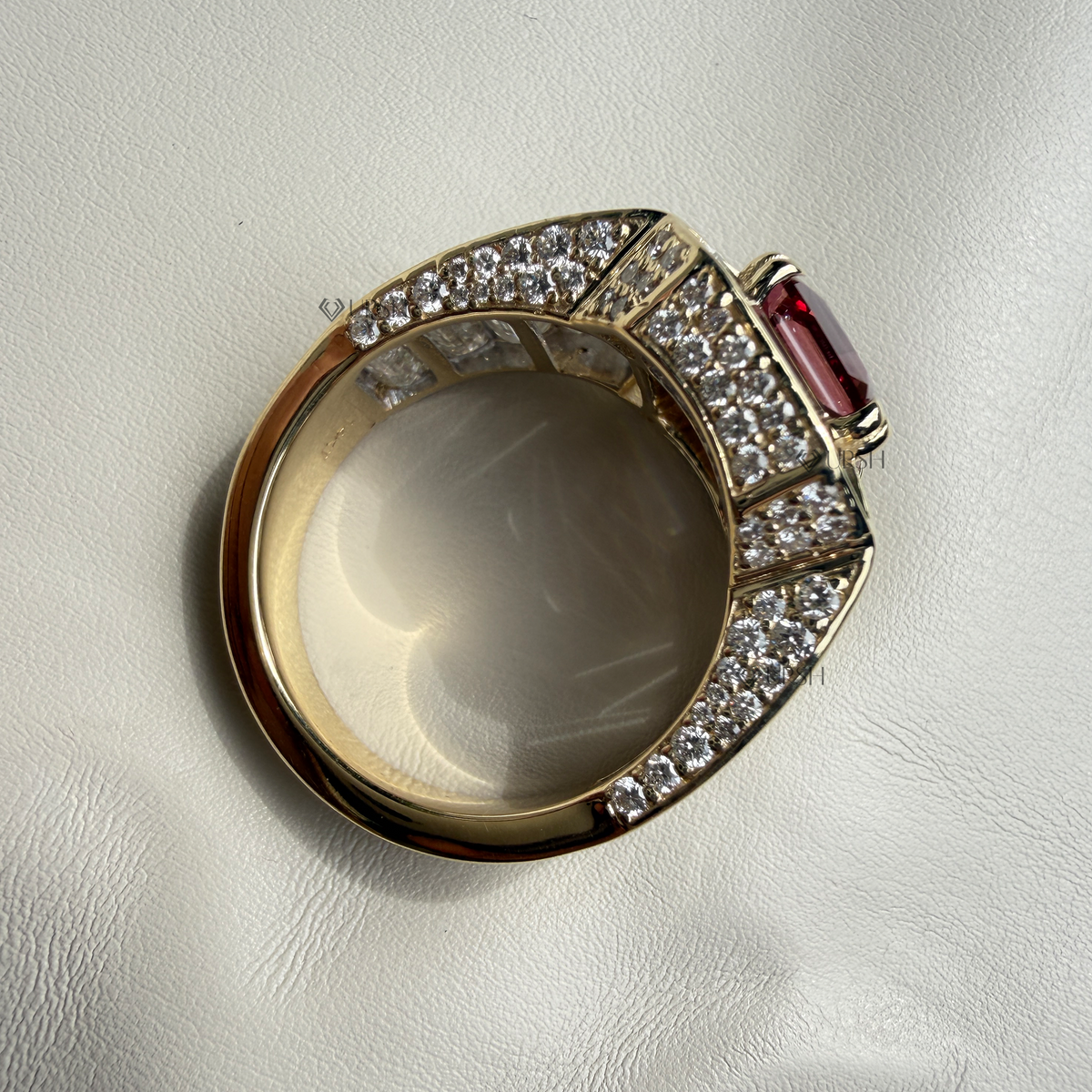 Under-finger view displaying solid gold comfort-fit inner shank, smooth gallery, and pavé backing