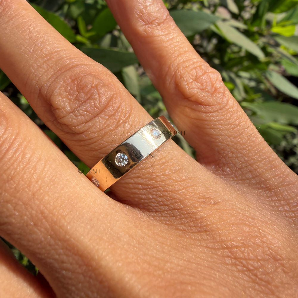 Substantial knuckle coverage and smooth flat edges of solid gold flush diamond band