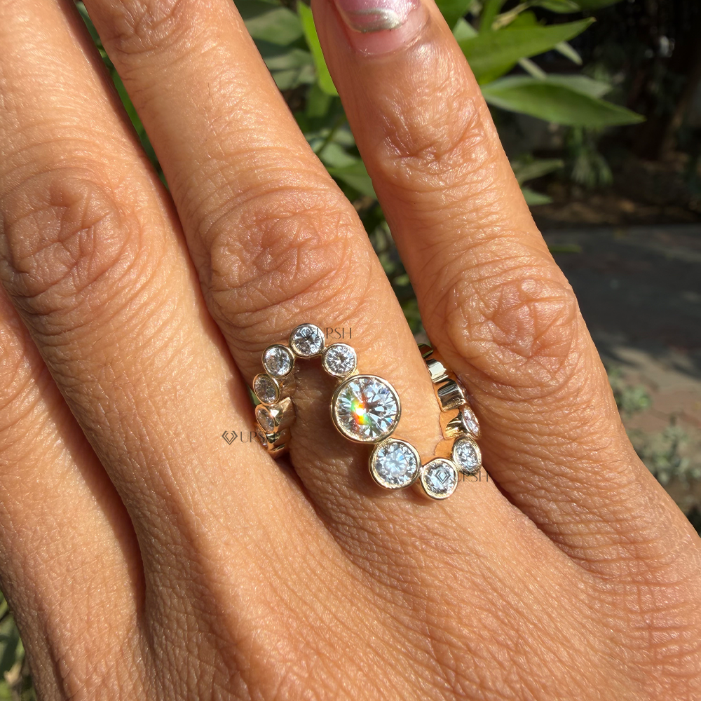 Detailed daylight view showing graduated round diamond bezel cups and S-shaped bypass contour