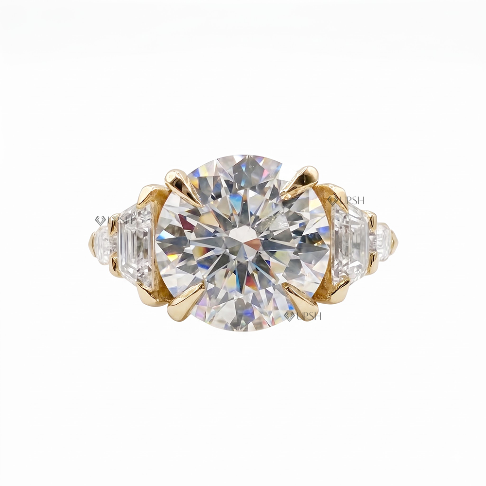 Solid yellow gold brilliant and step-cut multi-stone engagement ring on clean white backdrop
