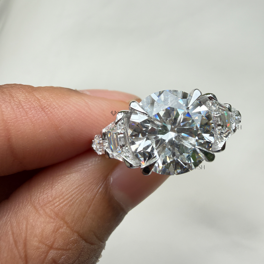 Close-up holding solid gold multi-stone diamond ring showcasing brilliant center fire and precise bullet-cut side facets