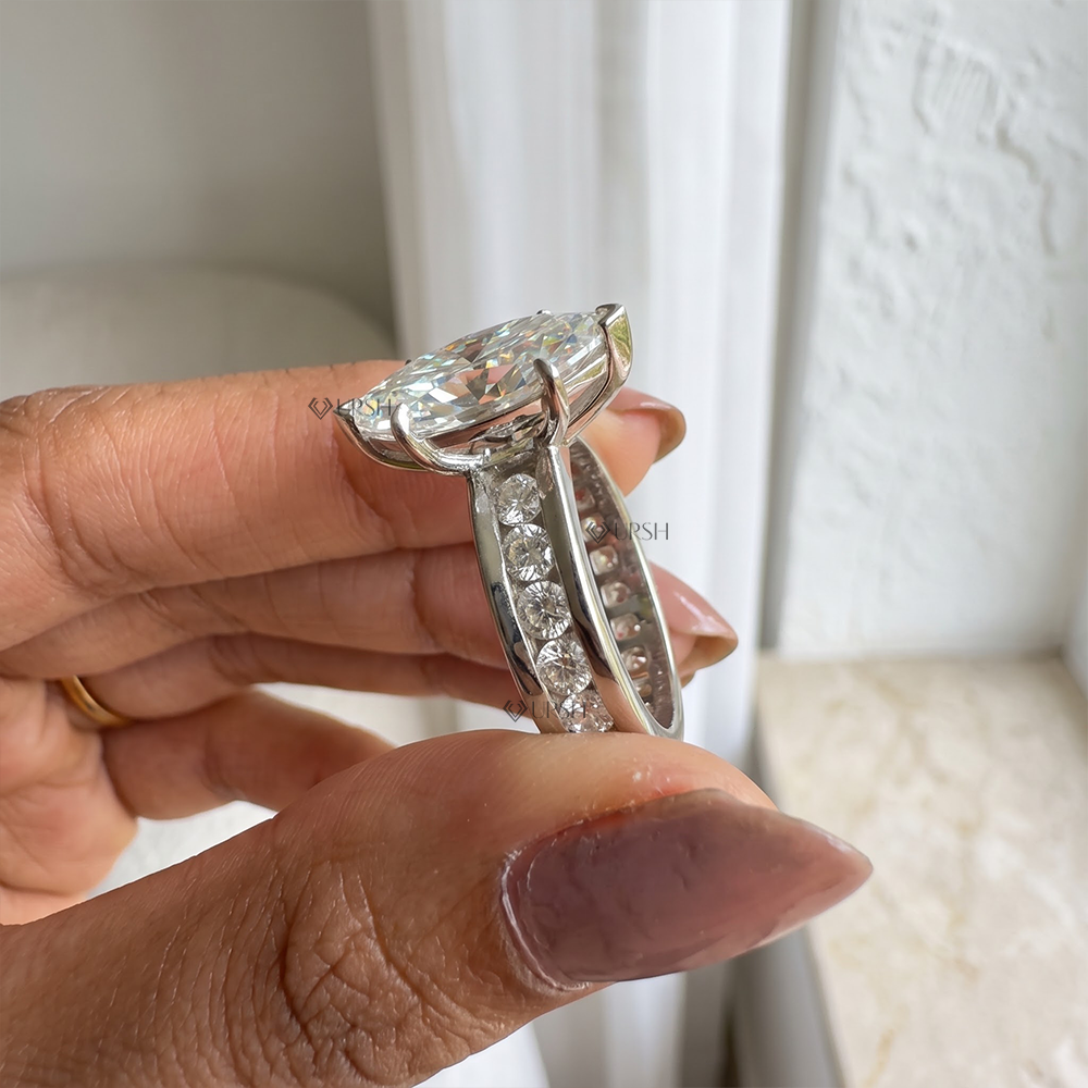 Side angle showing elevated 6-prong basket gallery and channel diamond walls