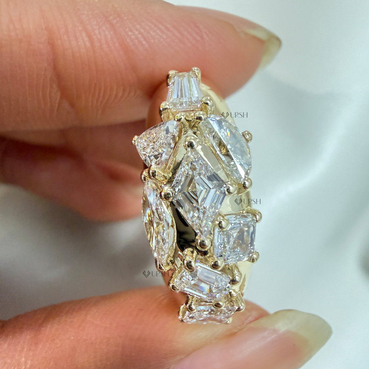 Side angle showing thick tapered gold dome profile and raised geometric diamonds