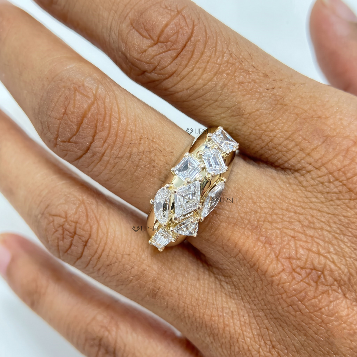 Multi-shape diamond mosaic statement dome ring worn on ring finger against skin tone