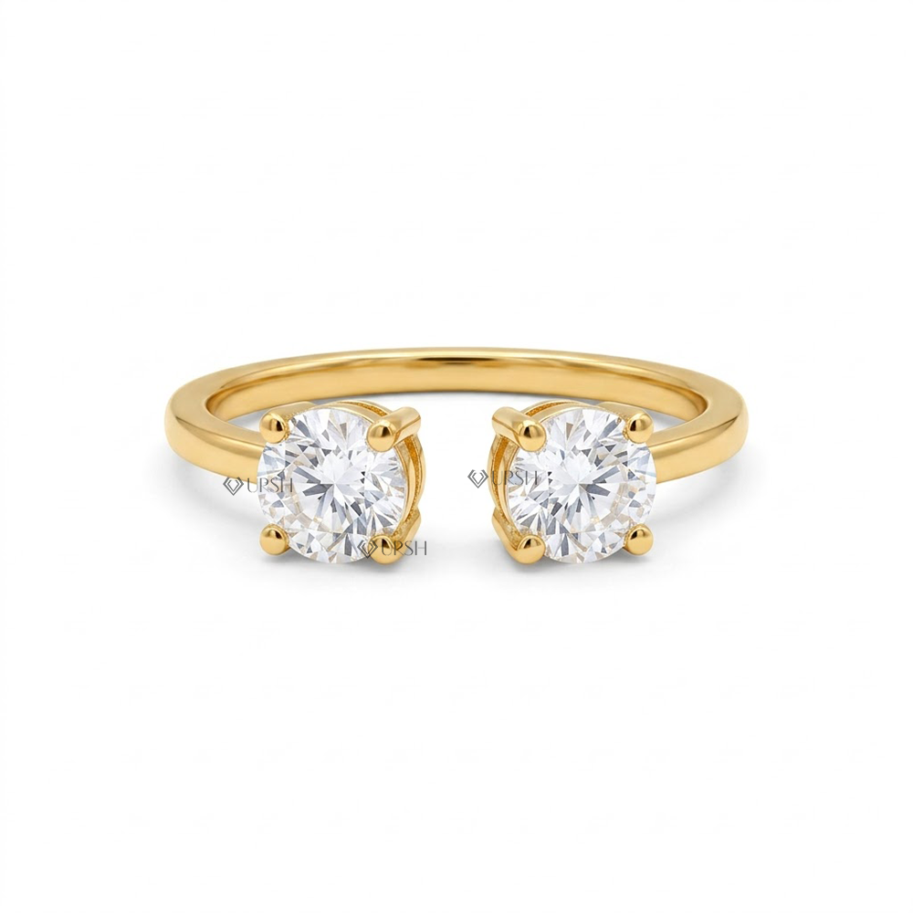 Solid yellow gold open gap cuff ring featuring two round brilliant lab grown diamonds facing each other