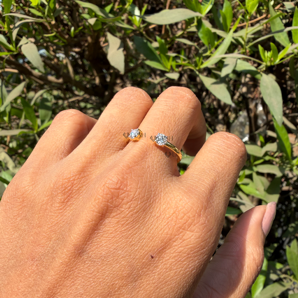 Understated elegance of solid gold two-stone open ring styled on hand