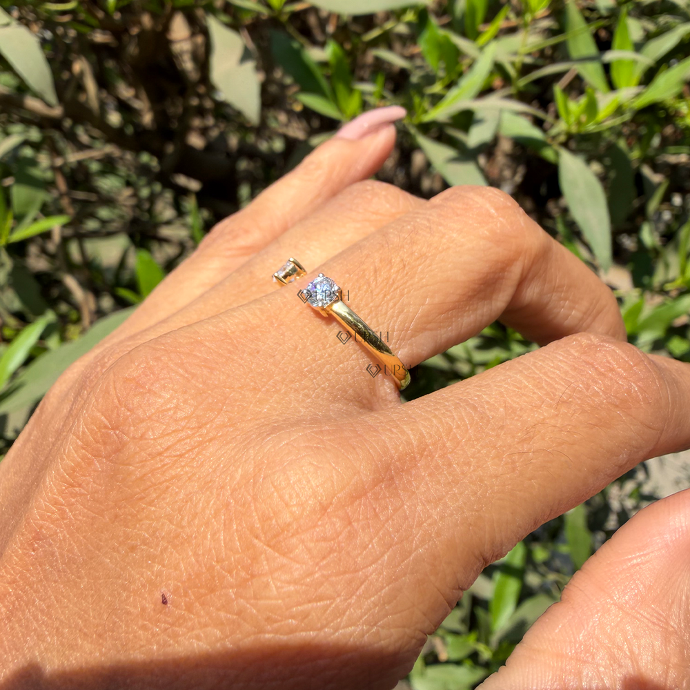 Holding open cuff diamond ring in sunlight displaying polished solid gold shank thickness