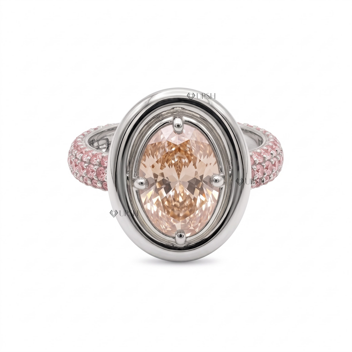 Solid white gold oval bezel-set pink diamond statement ring with matching pavé shank on clean white background