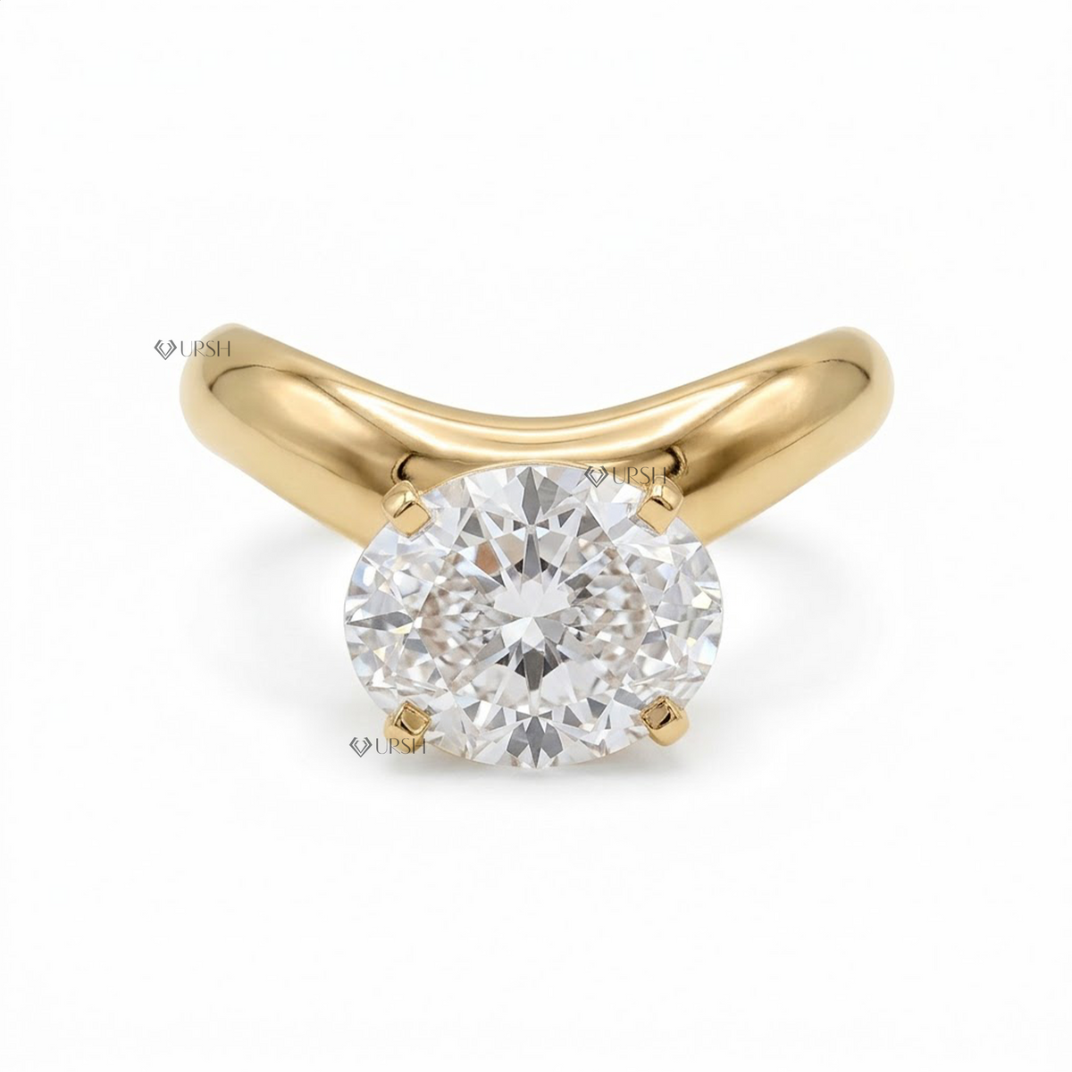 A yellow gold solitaire engagement ring featuring a round brilliant-cut diamond center stone in a four-prong setting, shown on a clean white background with a faint watermark.