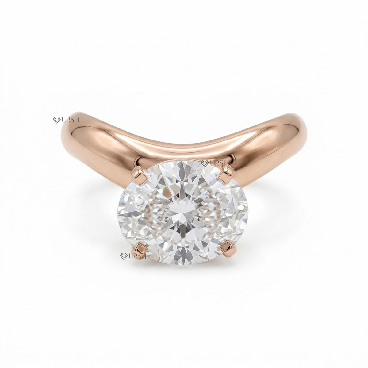 A rose gold solitaire engagement ring featuring a round brilliant-cut diamond set in a four-prong setting on a clean white background.