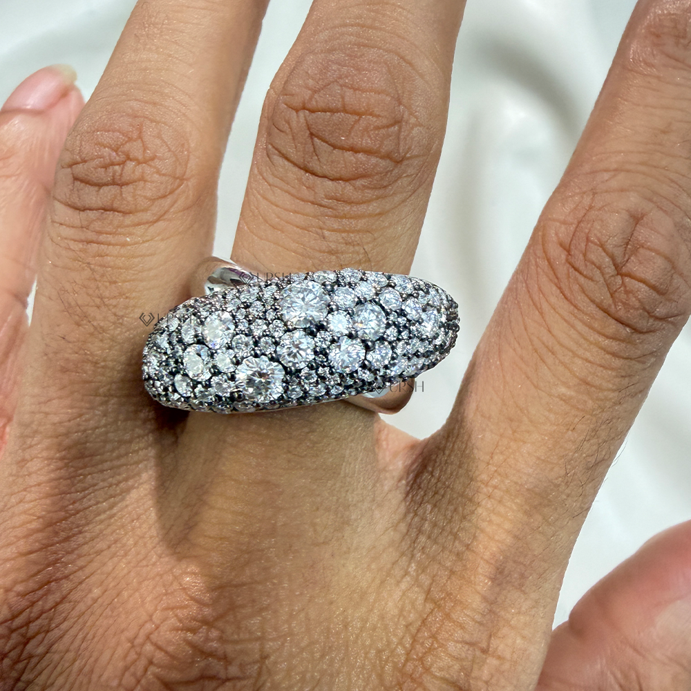 Chunky diamond bombé dome statement ring worn on finger showing substantial knuckle coverage