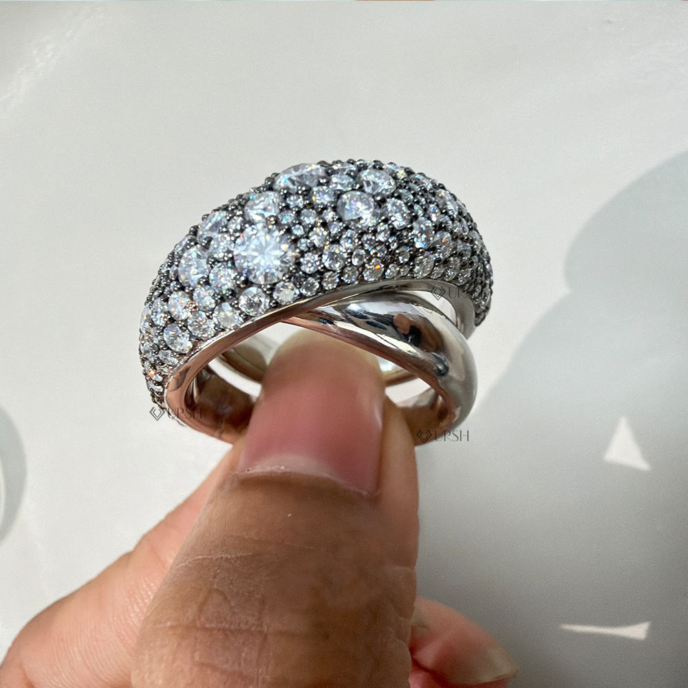Side angle showing double bypass ribbed band curvature and domed pavé volume
