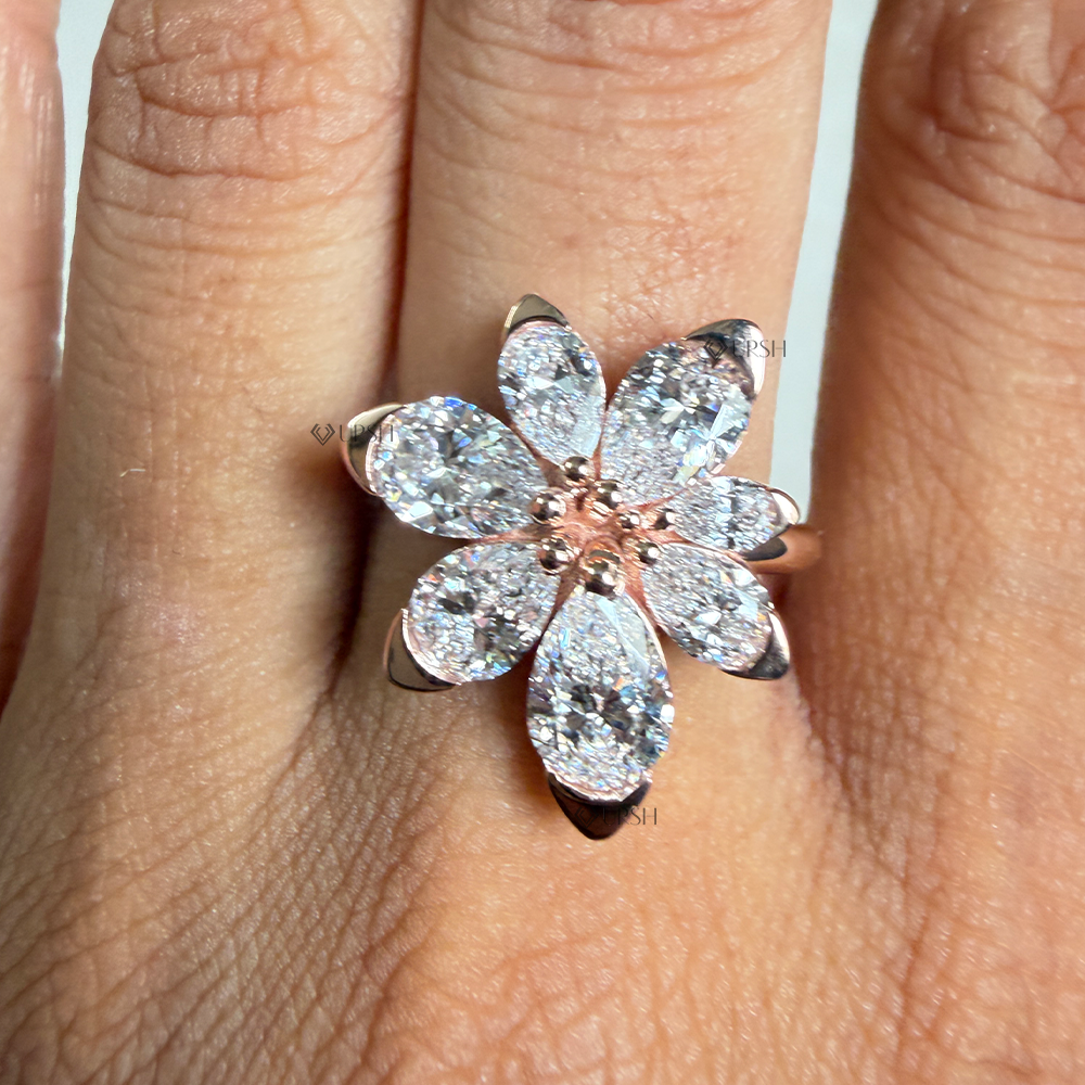 Large pear diamond floral blossom cocktail ring styled on hand