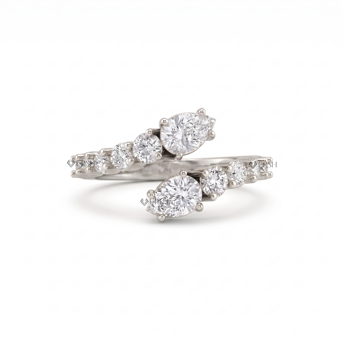 Solid white gold pear and round diamond open wrap ring on clean white background