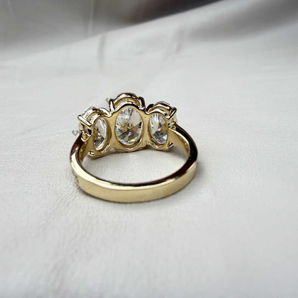 Under-finger view displaying solid gold comfort-fit band and sturdy gallery bridge