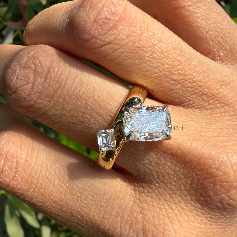 Finger placement view showing elongated cushion diamond paired with emerald step cut diamond
