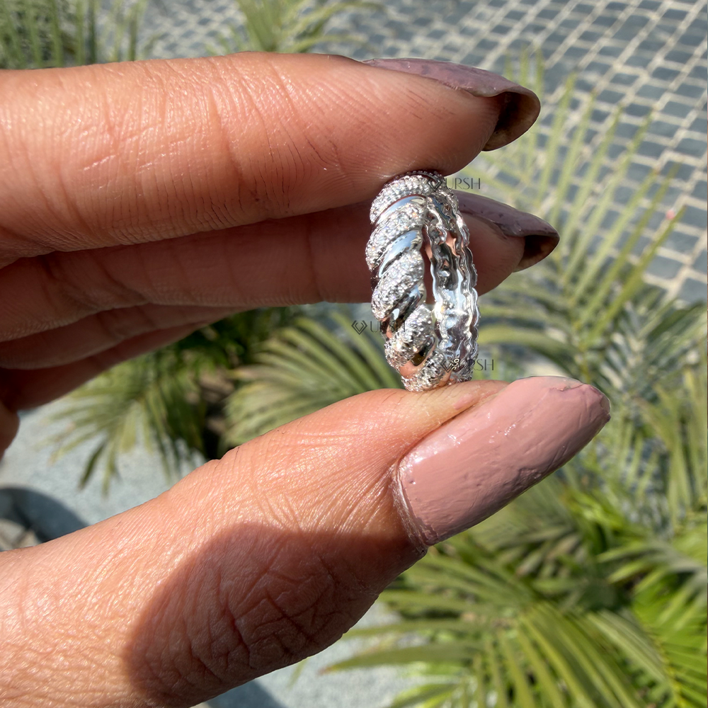Side angle holding twisted diamond band displaying comfortable rounded inner core and ribbed depth