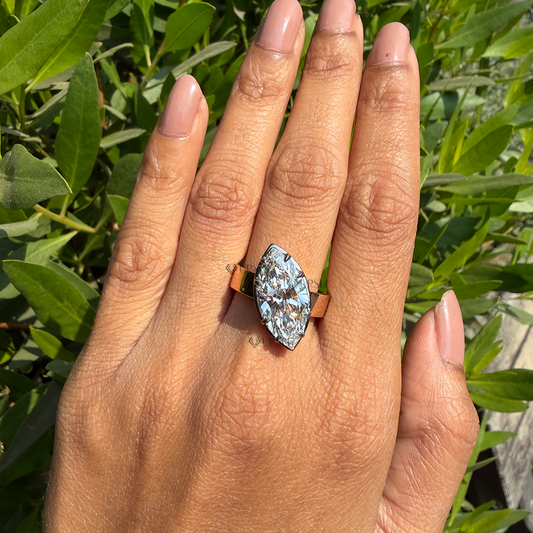 Bold architectural marquise cigar band ring worn on hand showcasing striking finger elongation