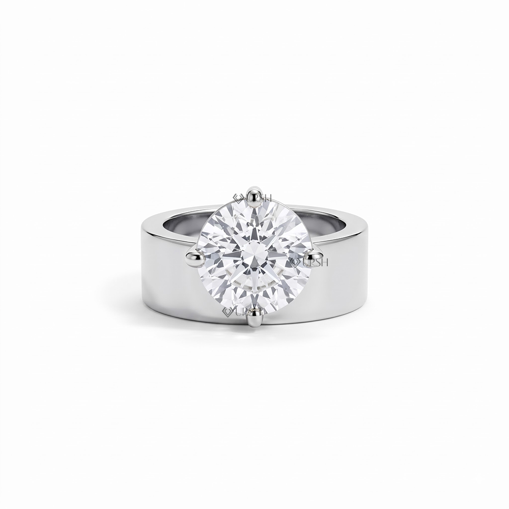 Solid white gold chunky cigar band engagement ring with round brilliant diamond solitaire on clean white background