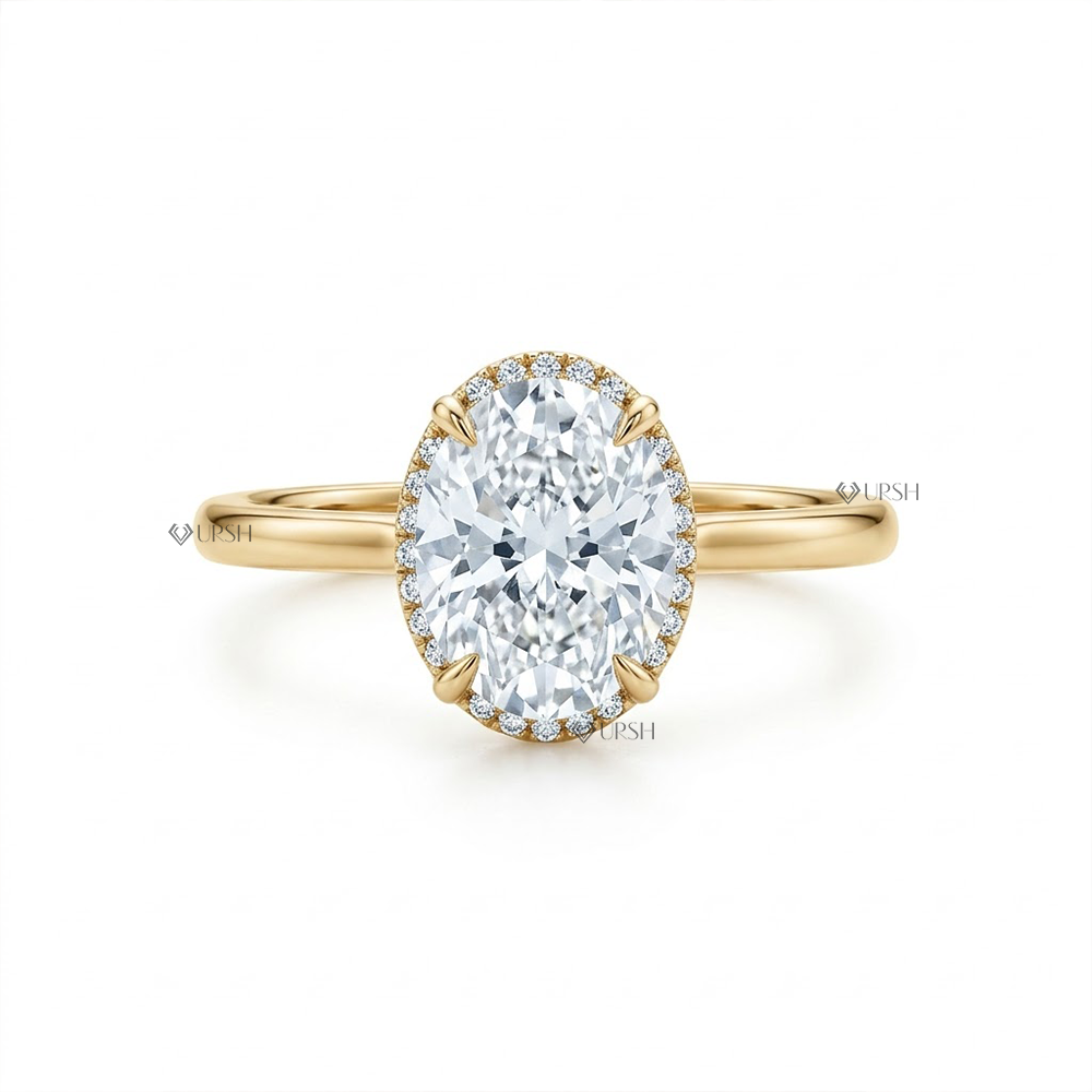 Solid yellow gold solitaire engagement ring featuring elongated oval lab grown diamond with hidden halo