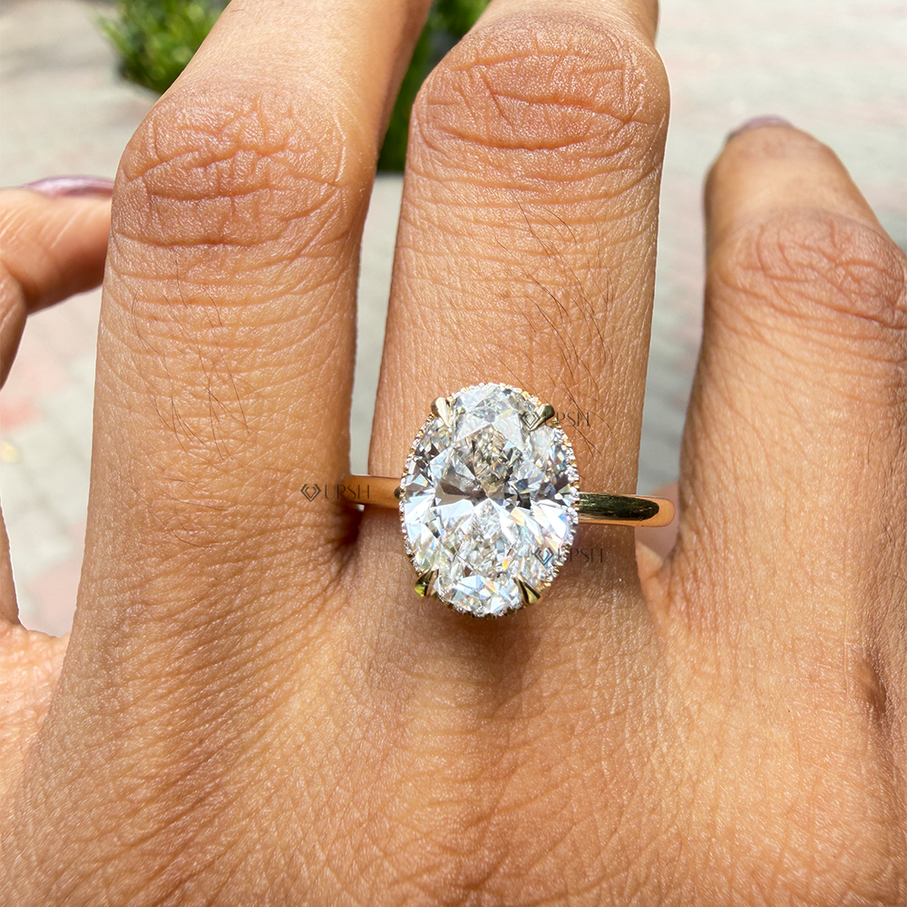 High-clarity sparkle and finger coverage of elongated oval cut lab diamond on yellow gold band