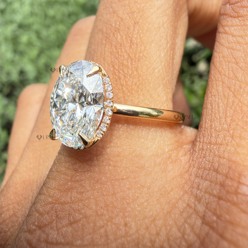 Side angle close-up showing micro pavé hidden halo under oval diamond center stone