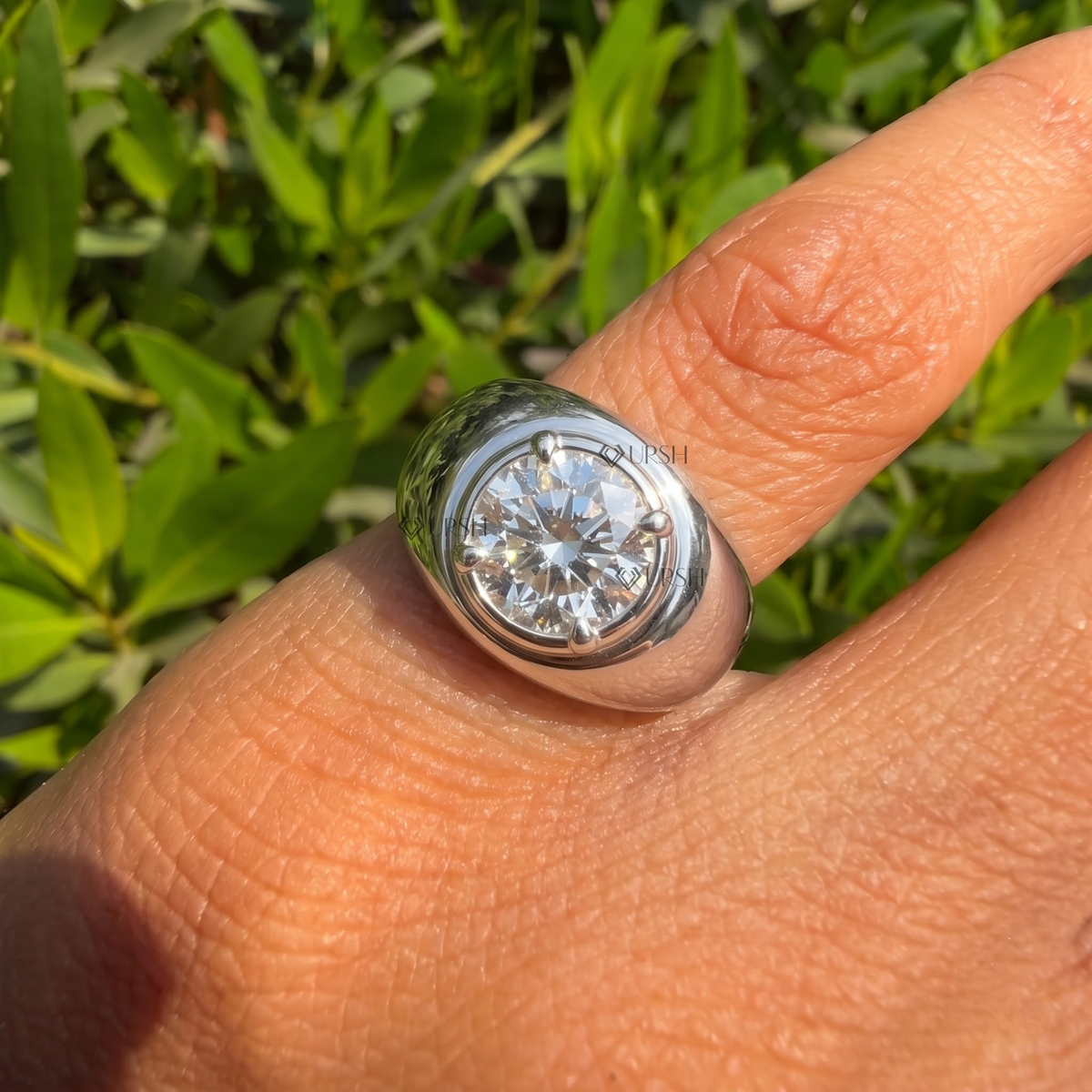 Daylight close-up of chunky dome solitaire ring worn on finger highlighting heavy gold polish