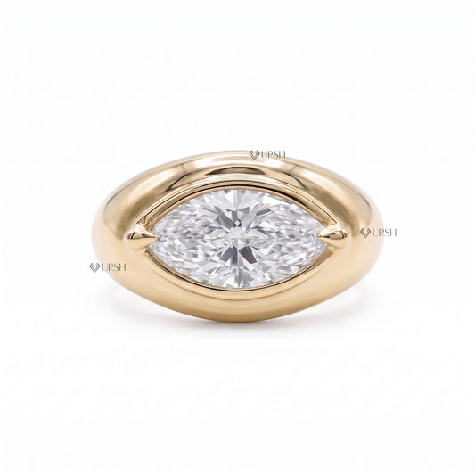 Close up of horizontal bezel set marquise diamond in high polish gold dome band