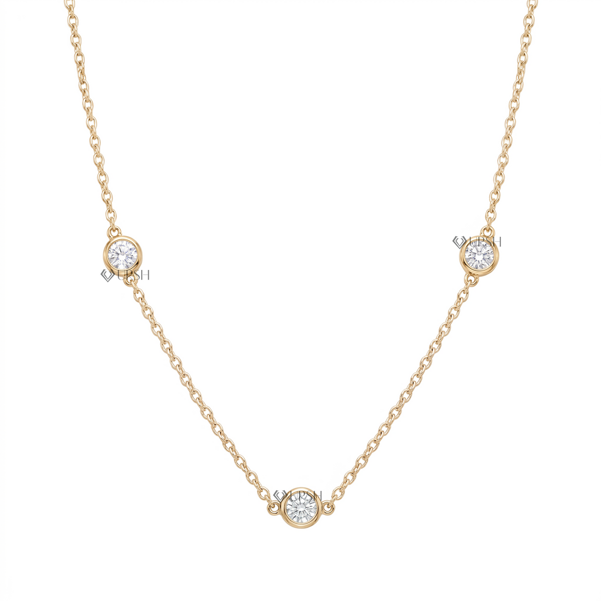 Solid yellow gold three stone bezel set diamond station cable chain necklace featuring round lab-grown diamonds floating along a delicate chain