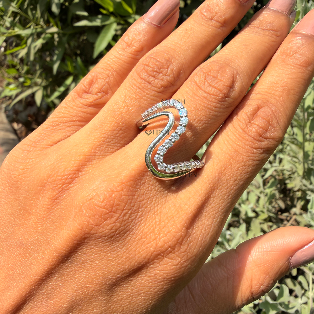 Solid white gold double wave diamond statement ring worn on hand outdoors
