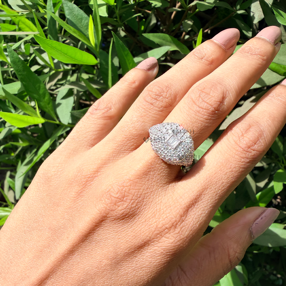 Dramatic finger coverage of white gold pavé dome statement ring in outdoor light