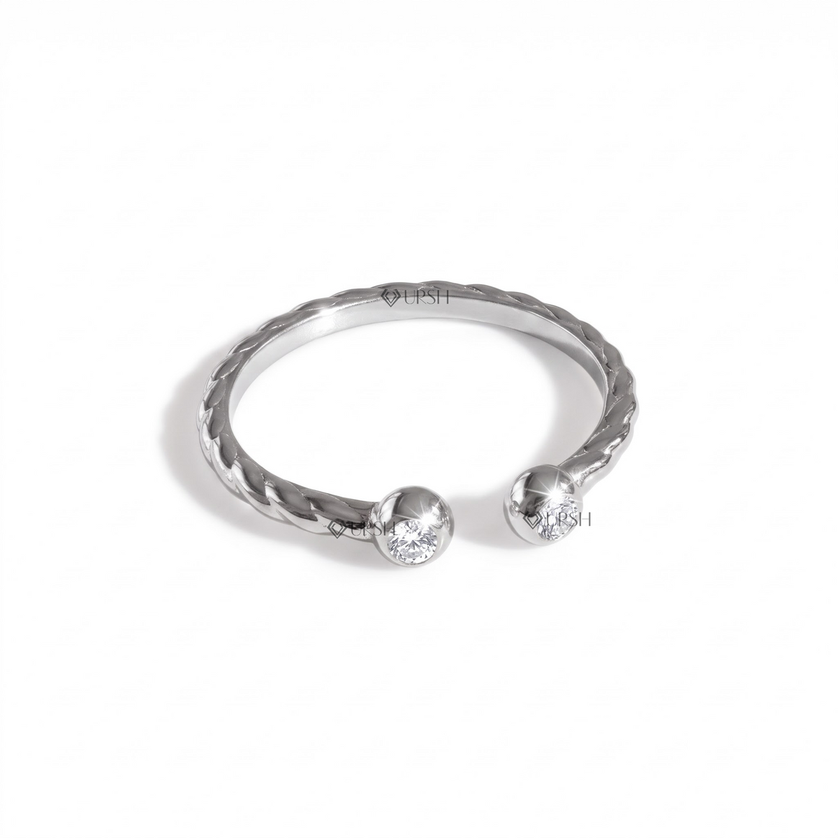 Solid white gold toi et moi open ring with bezel terminals on clean white background