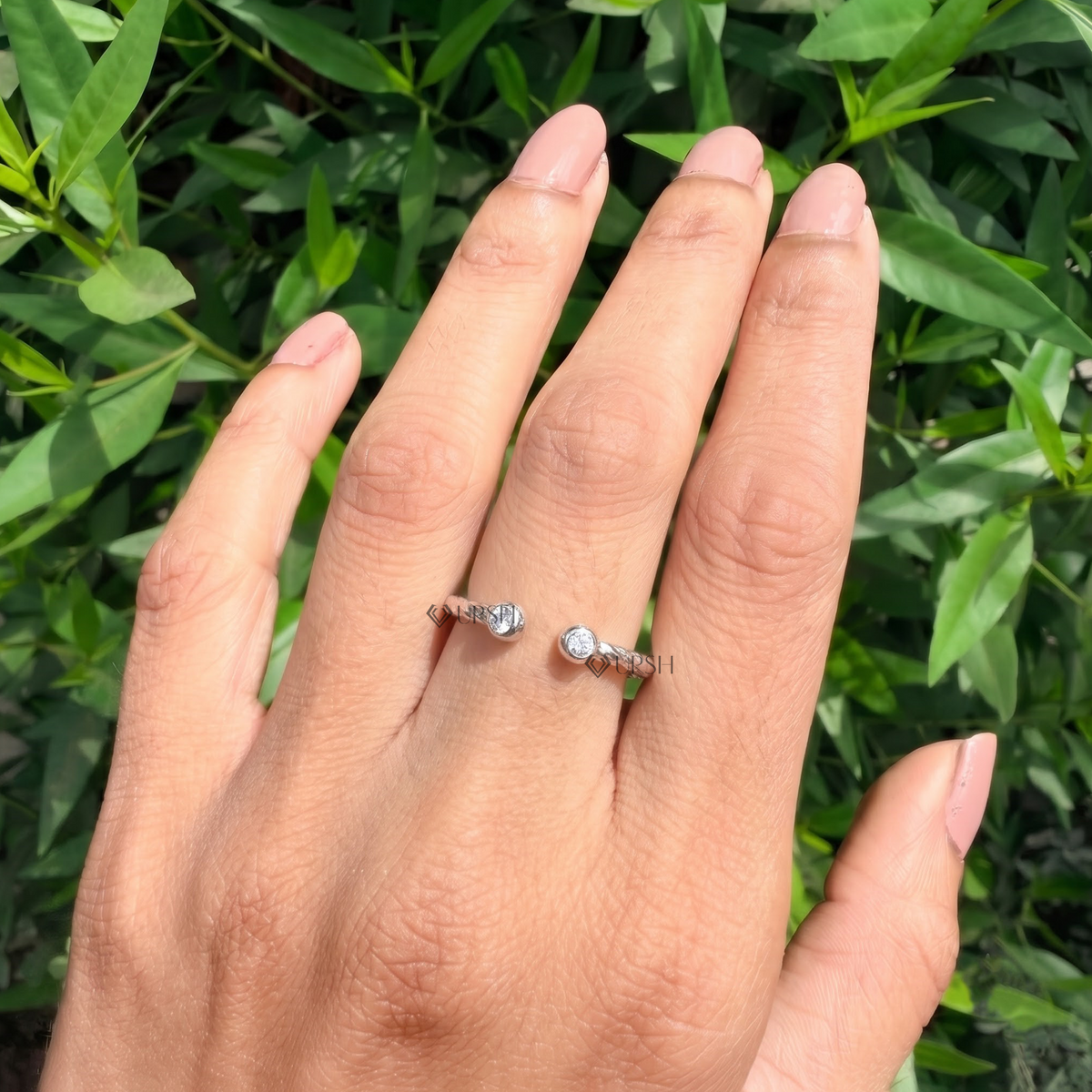 Open bypass diamond ring styled gracefully on finger in natural daylight