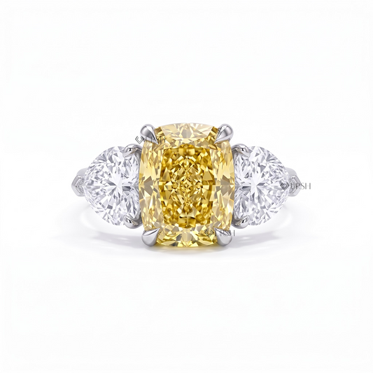 Solid two-tone gold three-stone engagement ring featuring a vivid canary yellow cushion lab diamond flanked by heart-cut side stones and a pavé band