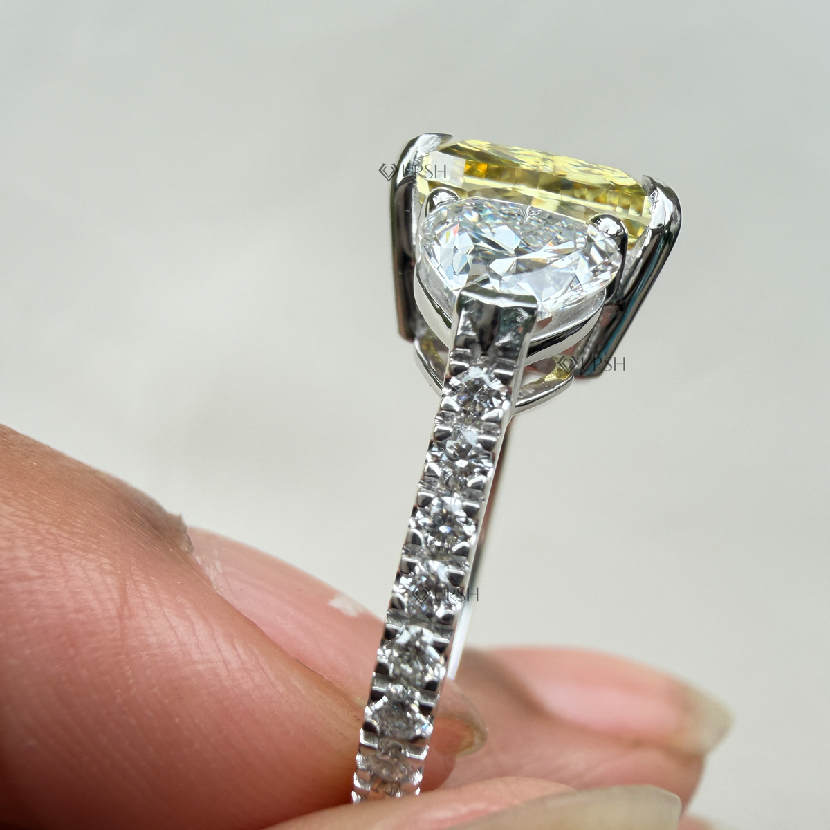 Under-finger view displaying solid gold comfort-fit pavé band and open gallery structure