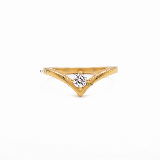 Solid yellow gold chevron wishbone wedding band featuring an asymmetrical prong set round lab diamond