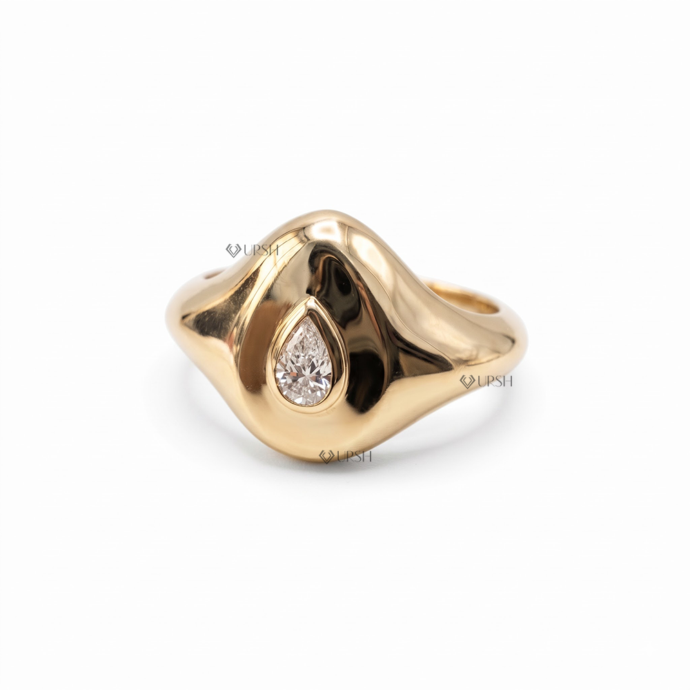 Solid yellow gold chunky dome signet ring featuring flush bezel set pear cut lab grown diamond
