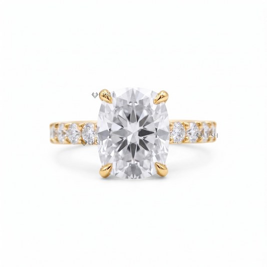 Solid yellow gold cushion cut solitaire engagement ring featuring an elongated center diamond on a prong-set band