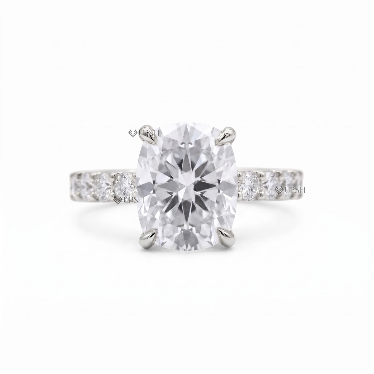 Solid white gold cushion cut solitaire ring with prong-set accent stones on clean white background