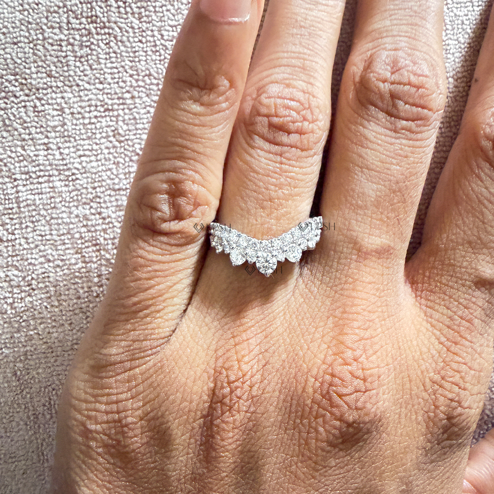 White gold contoured chevron stacking ring worn on hand showing finger elongation