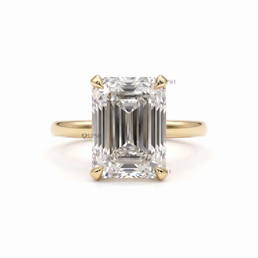 Solid yellow gold solitaire engagement ring set with step cut emerald lab diamond